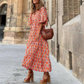 zomerse dames vintage jurk met vintage bloemenpatroon en oranje tinten