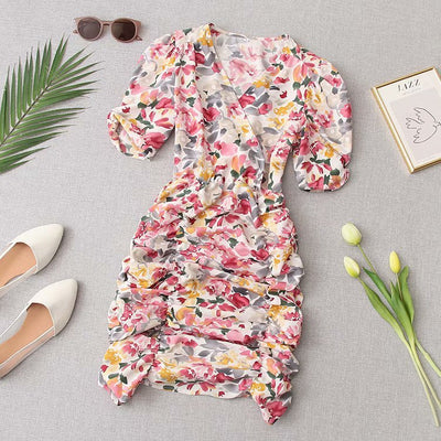 V-hals jurk met bloemenprint, plooien en pofmouwen Nexora Store