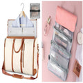 Grote reistas large cream travel bag with brown straps and folding pink makeup organizer with multiple mesh zip compartments