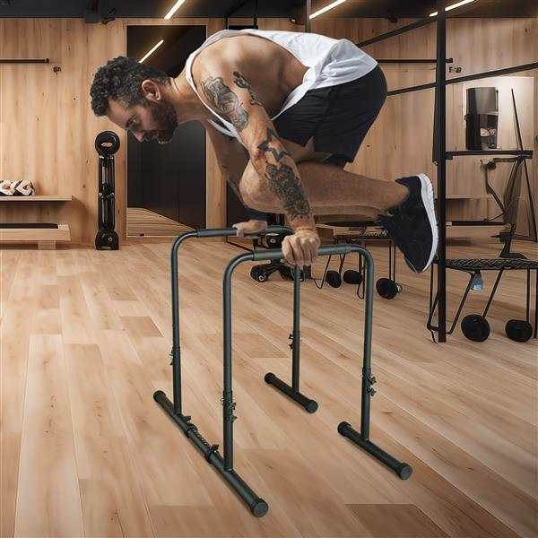 Man performing exercise on adjustable height Power Tower pull up rod stand in home gym