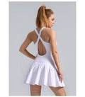 Woman wearing white backless dress made with Hoge Stretch fabric showing flexibility and comfort