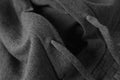 close-up of dark gray men's hoodies sweater fabric with drawstrings