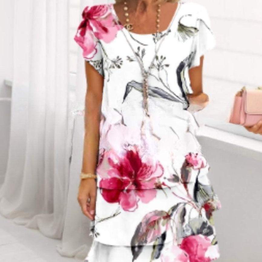 Dames jurk met korte mouwen en ronde hals in wit met roze bloemenprint