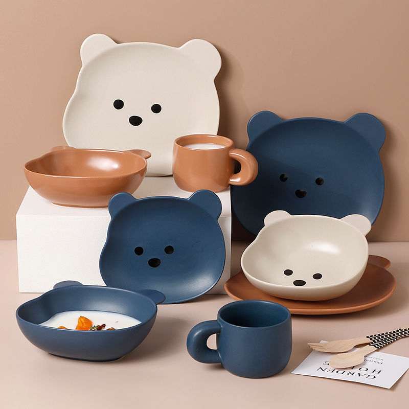 Home cartoon bear-shaped porcelain dinnerware set with plates, bowls, and mugs in beige, brown, and blue colors
