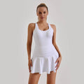 Woman wearing a white sleeveless hoge stretch dress showcasing comfort and flexibility fabric