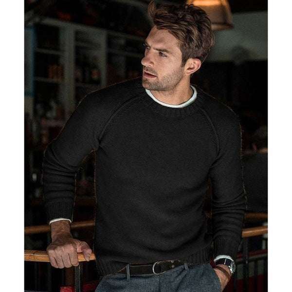 man wearing black slim fit men's trendy pullover with round collar and long sleeves indoors