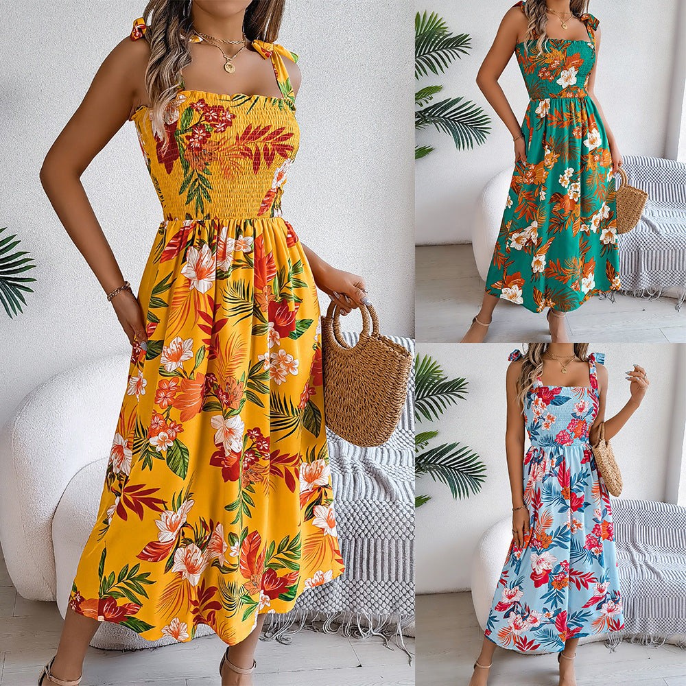 Vrouwen bloemenprint jarretelle korset jurk in gele, blauwe en groene kleuren, zomerse strandlange jurk