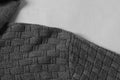 Close-up of grey woven pattern men's hoodies sweater fabric