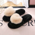 Zwarte pluche pantoffels voor dames met grote beige pompons voor extra comfort en warmte