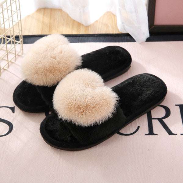 Zwarte pluche pantoffels voor dames met grote beige pompons voor extra comfort en warmte