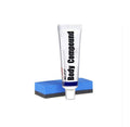 Tube of body compound and blue sanding sponge for car scratch removal Autokrassenverwijderaar