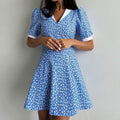 Blauwe bloemenjurk met hoge taille en revers Nexora Store