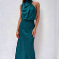 Dames zomerjurk zonder mouwen in elegante teal kleur met hoge hals en vloeiende stof