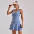 woman wearing blue sleeveless dress made from hoge stretch fabric