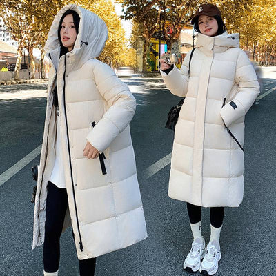 Women wearing white cold-proof cotton-padded jacket with hood outdoors