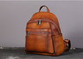 Vintage brown leather backpack with antique silver hardware and adjustable straps