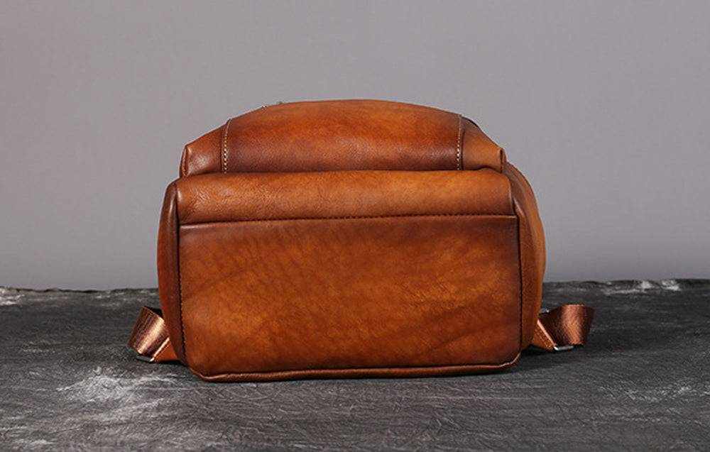 Vintage brown leather backpack with antique silver hardware and adjustable straps